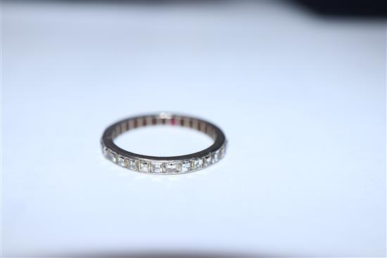 A white metal and square cut diamond set full eternity ring, size O/P.